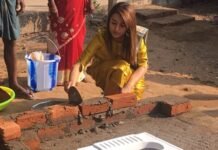 Actress Trisha Cementing Bricks For A Toilet