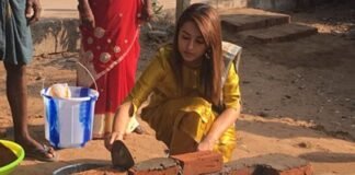 Actress Trisha Cementing Bricks For A Toilet